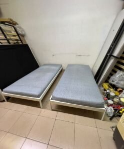 Two single beds with white metal frames, featuring lightweight foam mattresses in a light gray/blue color—similar to the ÅGOTNES foam mattress from IKEA. - Image 7