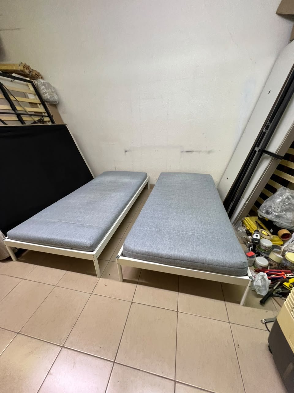 Two single beds with white metal frames, featuring lightweight foam mattresses in a light gray/blue color—similar to the ÅGOTNES foam mattress from IKEA. - Image 7