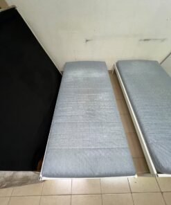 Two single beds with white metal frames, featuring lightweight foam mattresses in a light gray/blue color—similar to the ÅGOTNES foam mattress from IKEA. - Image 9