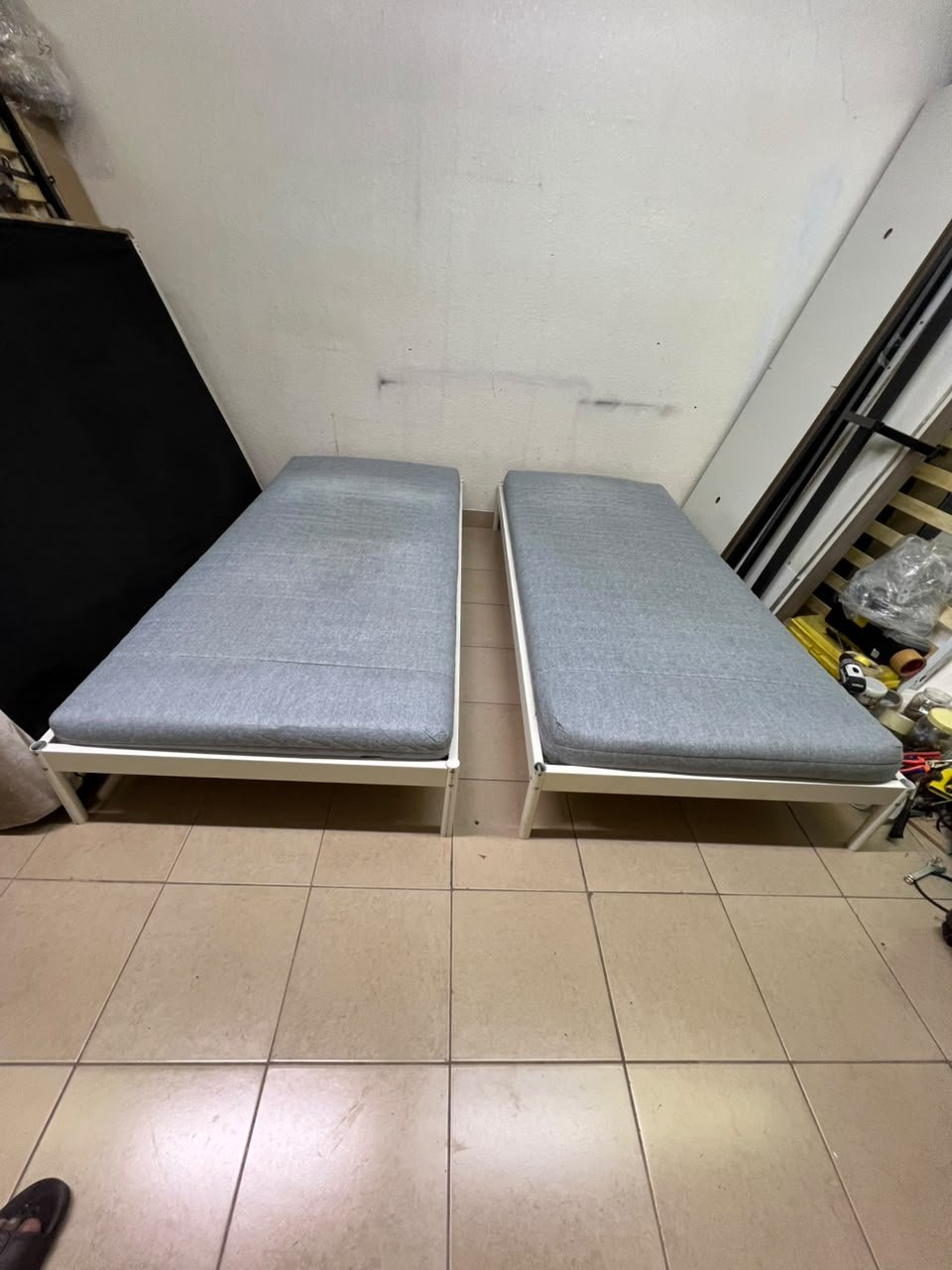 Two single beds with white metal frames, featuring lightweight foam mattresses in a light gray/blue color—similar to the ÅGOTNES foam mattress from IKEA. - Image 10