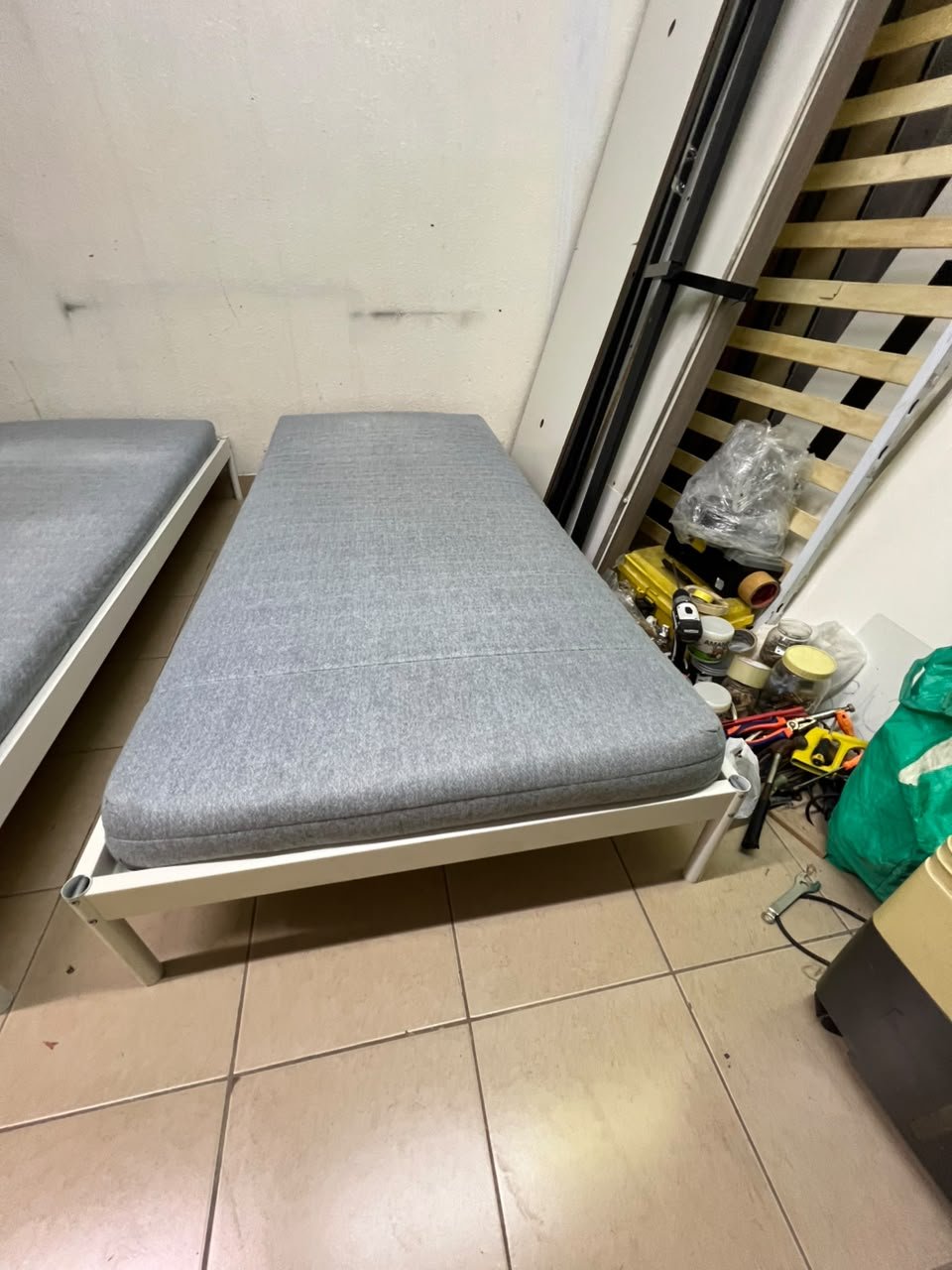 Two single beds with white metal frames, featuring lightweight foam mattresses in a light gray/blue color—similar to the ÅGOTNES foam mattress from IKEA. - Image 4