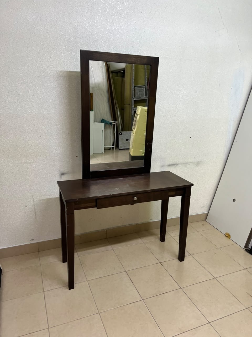 A dark brown (espresso) wooden vanity table with a minimalist design, featuring a rectangular surface, a small central drawer, and an upright vertical mirror set within a tall wooden frame. - Image 9