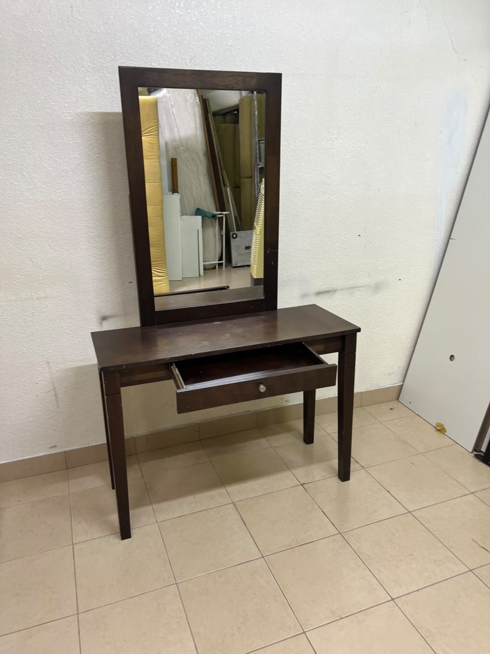 A dark brown (espresso) wooden vanity table with a minimalist design, featuring a rectangular surface, a small central drawer, and an upright vertical mirror set within a tall wooden frame. - Image 2