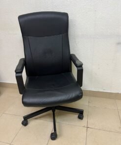 An IKEA swivel office chair—specifically the MILLBERGET model—in black. - Image 4