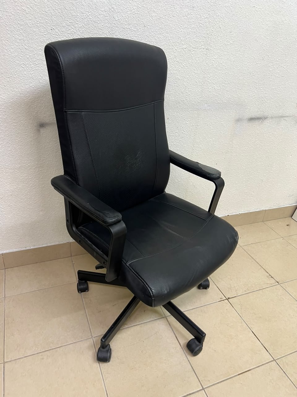 An IKEA swivel office chair—specifically the MILLBERGET model—in black. - Image 5