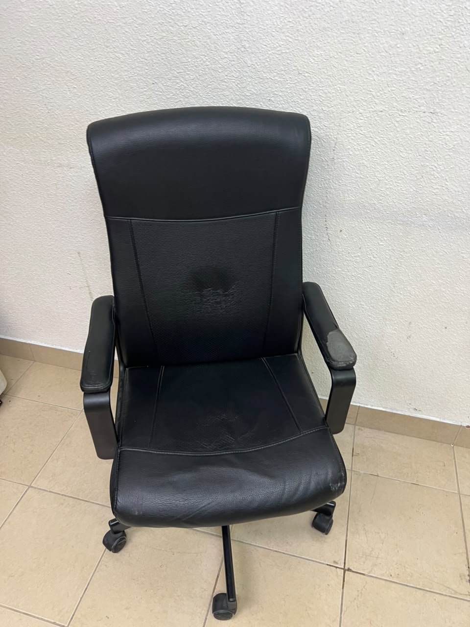 An IKEA swivel office chair—specifically the MILLBERGET model—in black. - Image 6