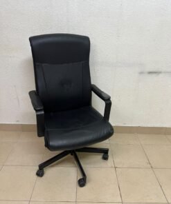An IKEA swivel office chair—specifically the MILLBERGET model—in black. - Image 7