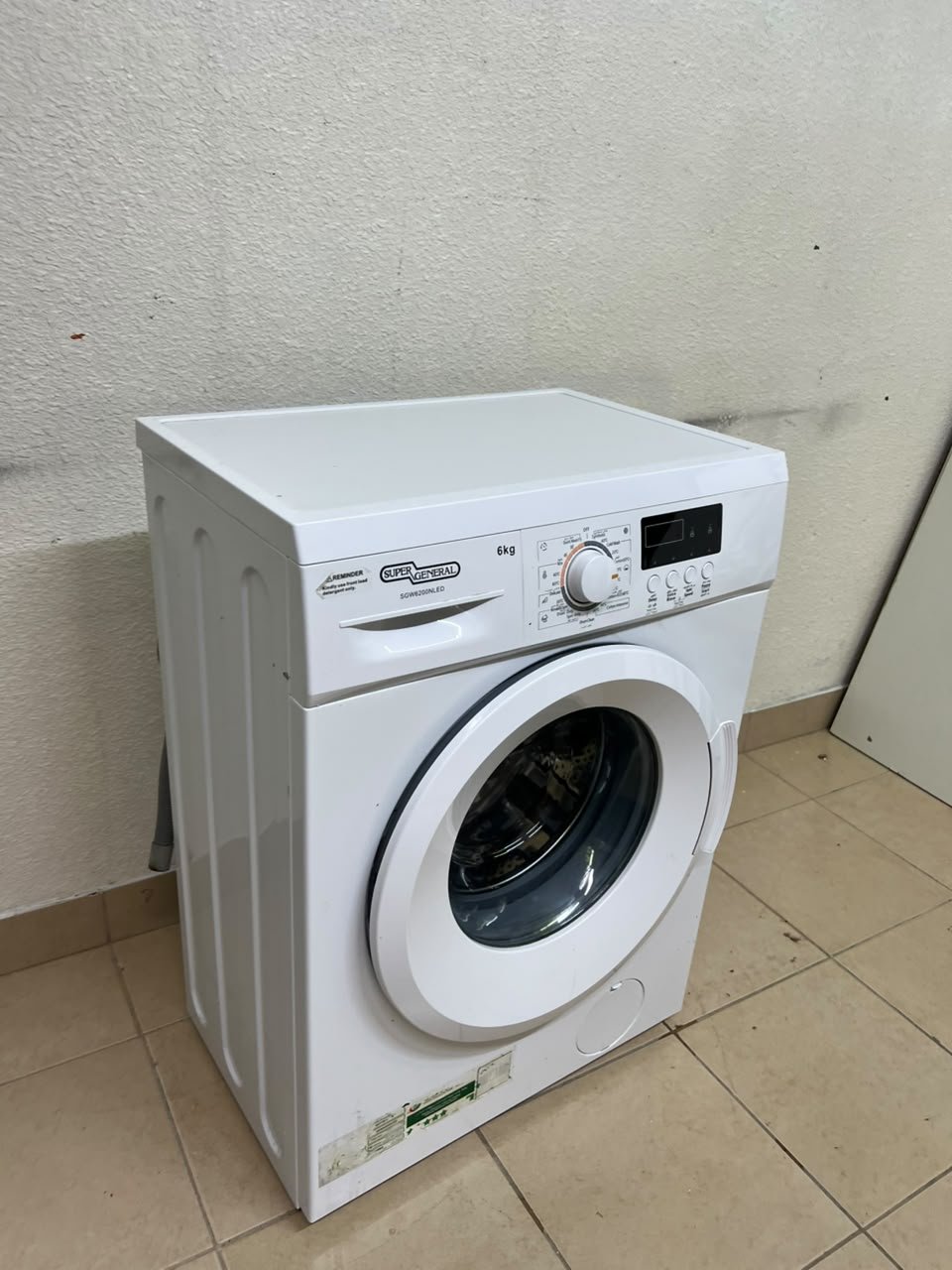 The image shows a Super General front-load washing machine (6 kg capacity, 1000 RPM, model similar to SGW6100NLED). - Image 2