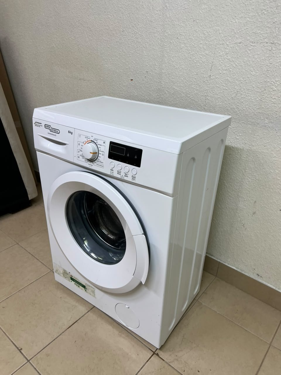 The image shows a Super General front-load washing machine (6 kg capacity, 1000 RPM, model similar to SGW6100NLED). - Image 3