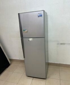 A silver-colored, two-door refrigerator (with a top-mounted freezer and a refrigerator section below) from the brand Hitachi.