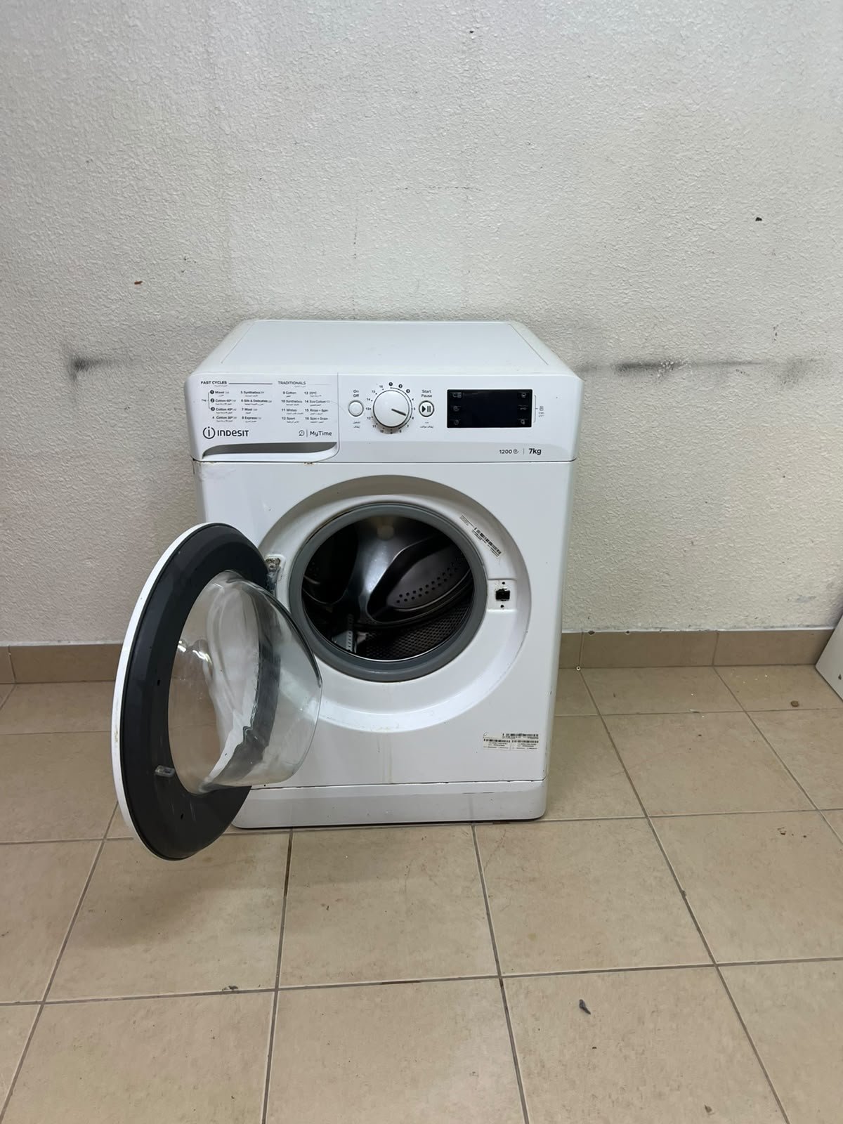 A white, front-loading washing machine from the brand Indesit—part of the "MyTime" range—featuring a 7 kg capacity and a spin speed of 1200 rpm. - Image 9