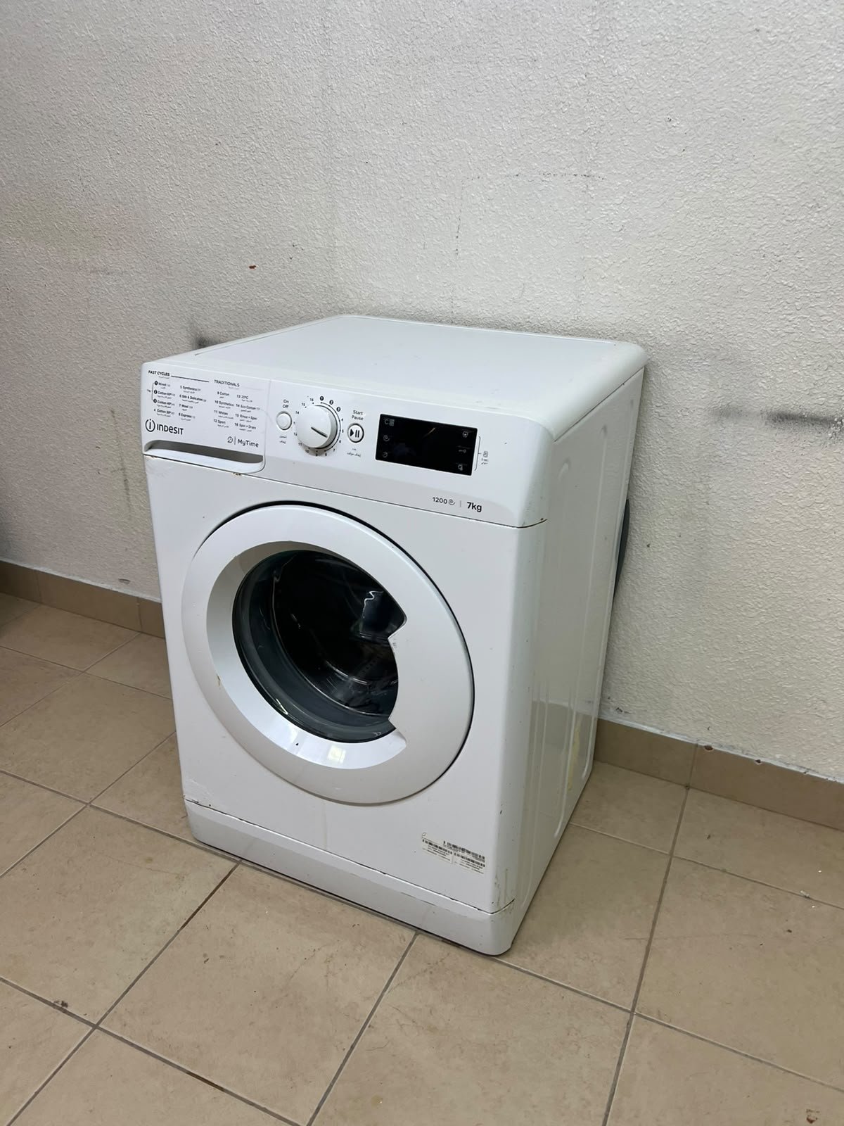 A white, front-loading washing machine from the brand Indesit—part of the "MyTime" range—featuring a 7 kg capacity and a spin speed of 1200 rpm. - Image 10