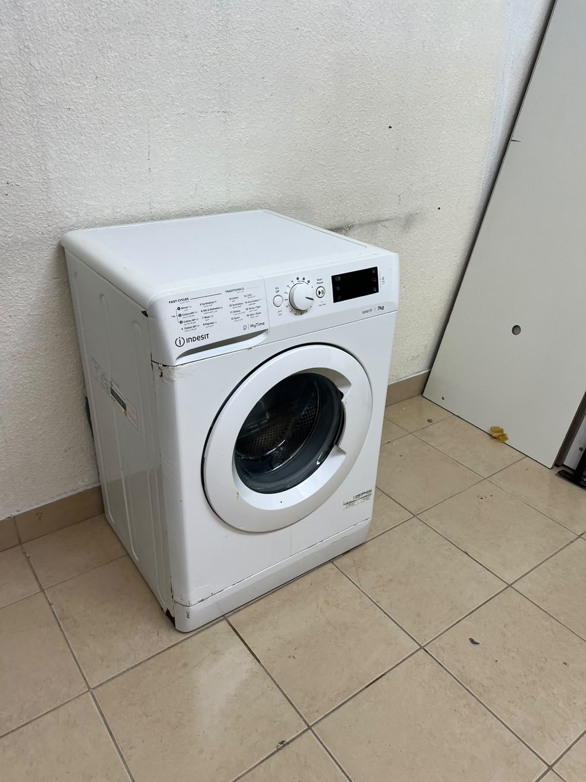 A white, front-loading washing machine from the brand Indesit—part of the "MyTime" range—featuring a 7 kg capacity and a spin speed of 1200 rpm. - Image 11