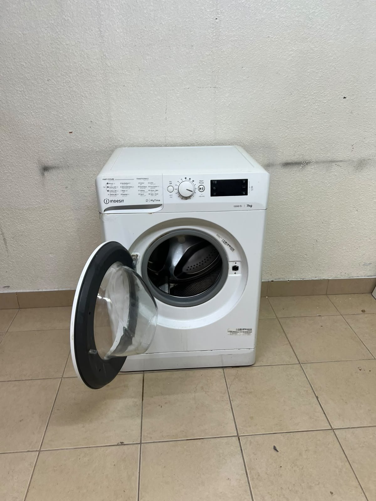 A white, front-loading washing machine from the brand Indesit—part of the "MyTime" range—featuring a 7 kg capacity and a spin speed of 1200 rpm. - Image 12