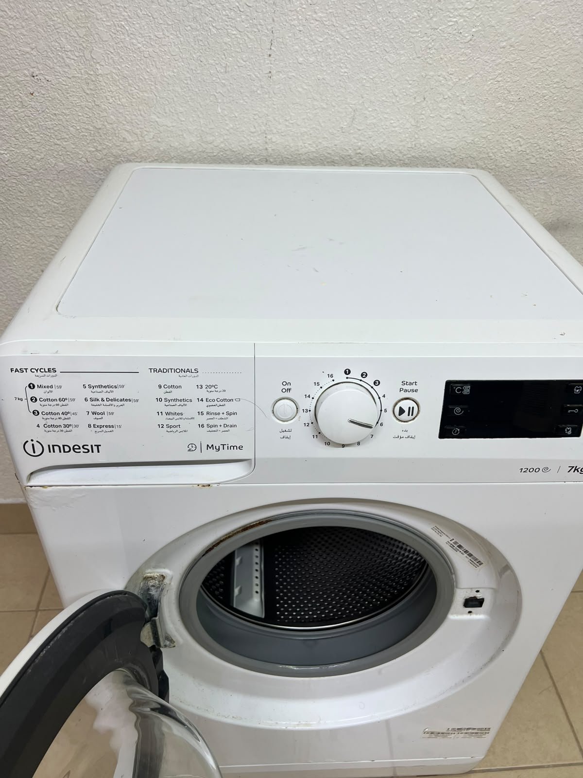 A white, front-loading washing machine from the brand Indesit—part of the "MyTime" range—featuring a 7 kg capacity and a spin speed of 1200 rpm. - Image 8