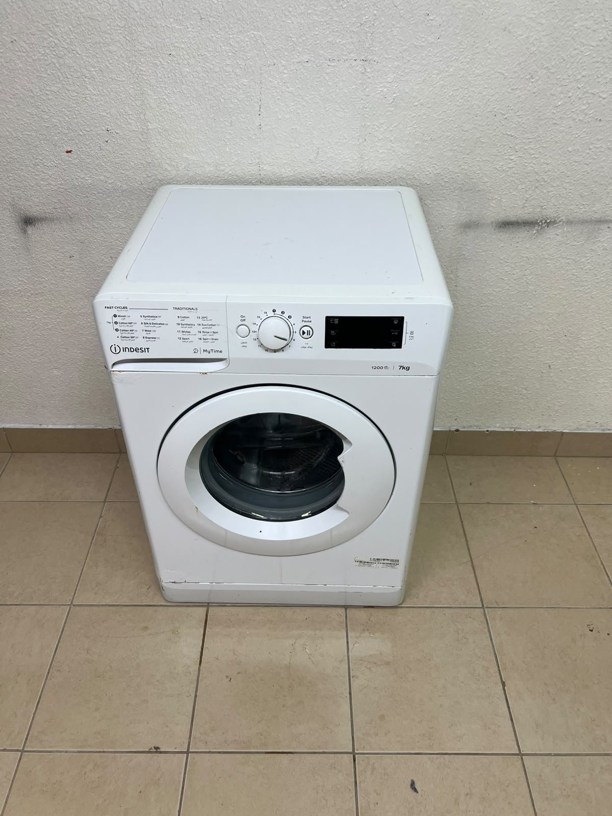 A white, front-loading washing machine from the brand Indesit—part of the "MyTime" range—featuring a 7 kg capacity and a spin speed of 1200 rpm. - Image 2
