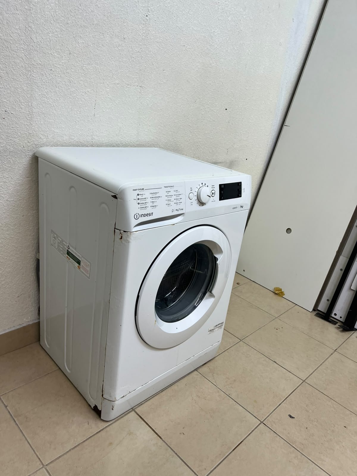 A white, front-loading washing machine from the brand Indesit—part of the "MyTime" range—featuring a 7 kg capacity and a spin speed of 1200 rpm. - Image 4
