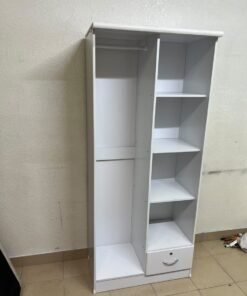 A freestanding, white, geometric wooden wardrobe (closet). - Image 9