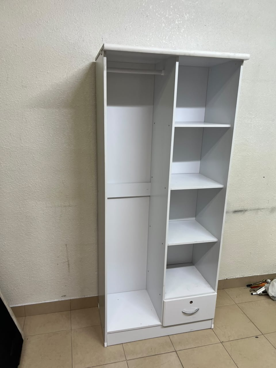 A freestanding, white, geometric wooden wardrobe (closet). - Image 9
