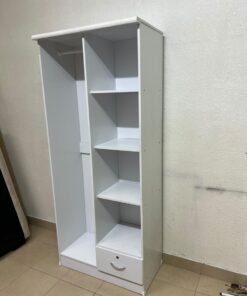 A freestanding, white, geometric wooden wardrobe (closet). - Image 2