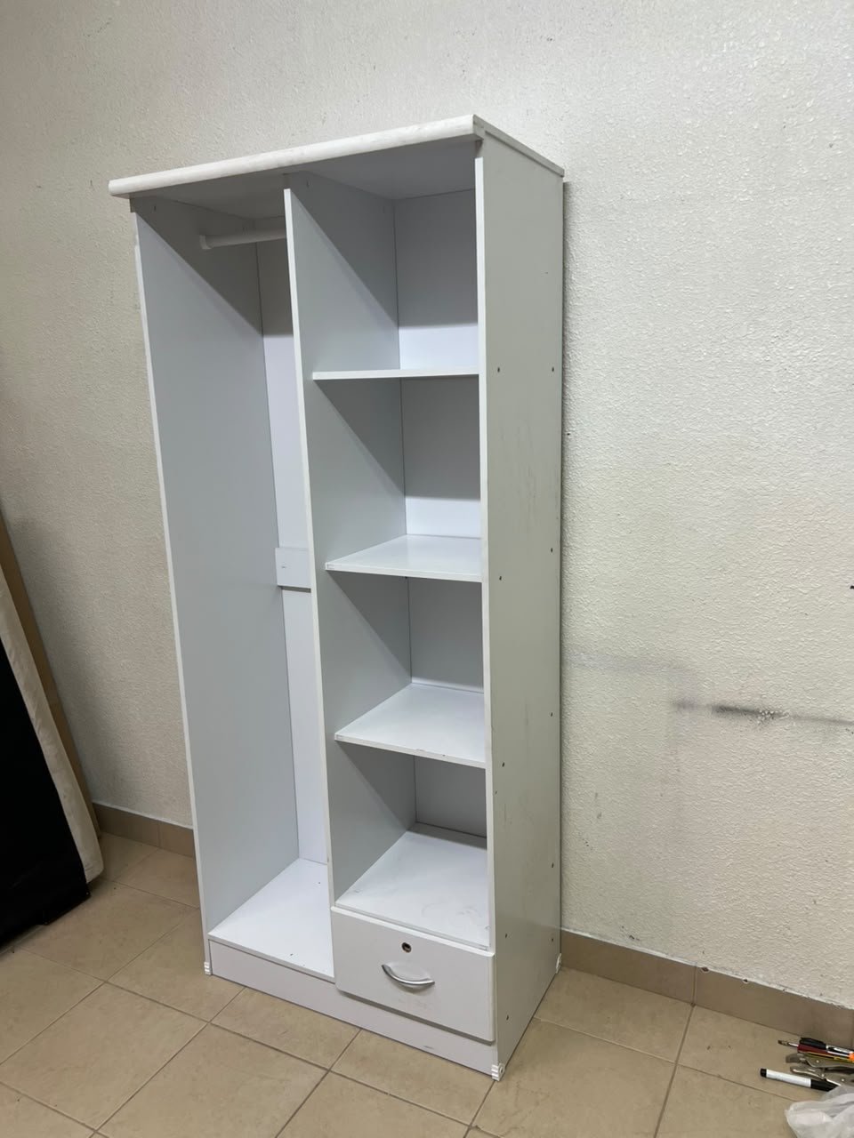 A freestanding, white, geometric wooden wardrobe (closet). - Image 2