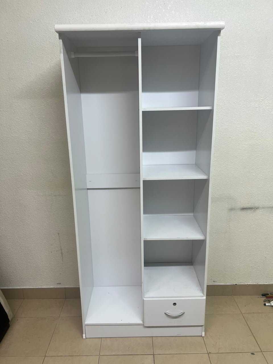 A freestanding, white, geometric wooden wardrobe (closet). - Image 4