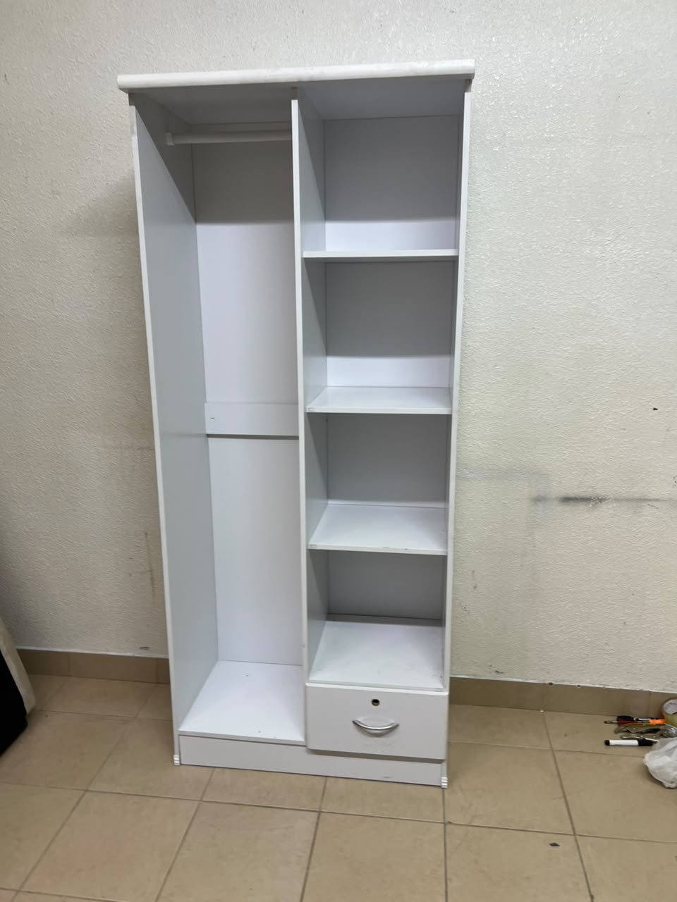A freestanding, white, geometric wooden wardrobe (closet). - Image 6