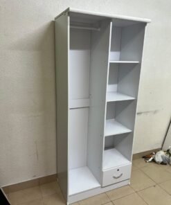 A freestanding, white, geometric wooden wardrobe (closet). - Image 7