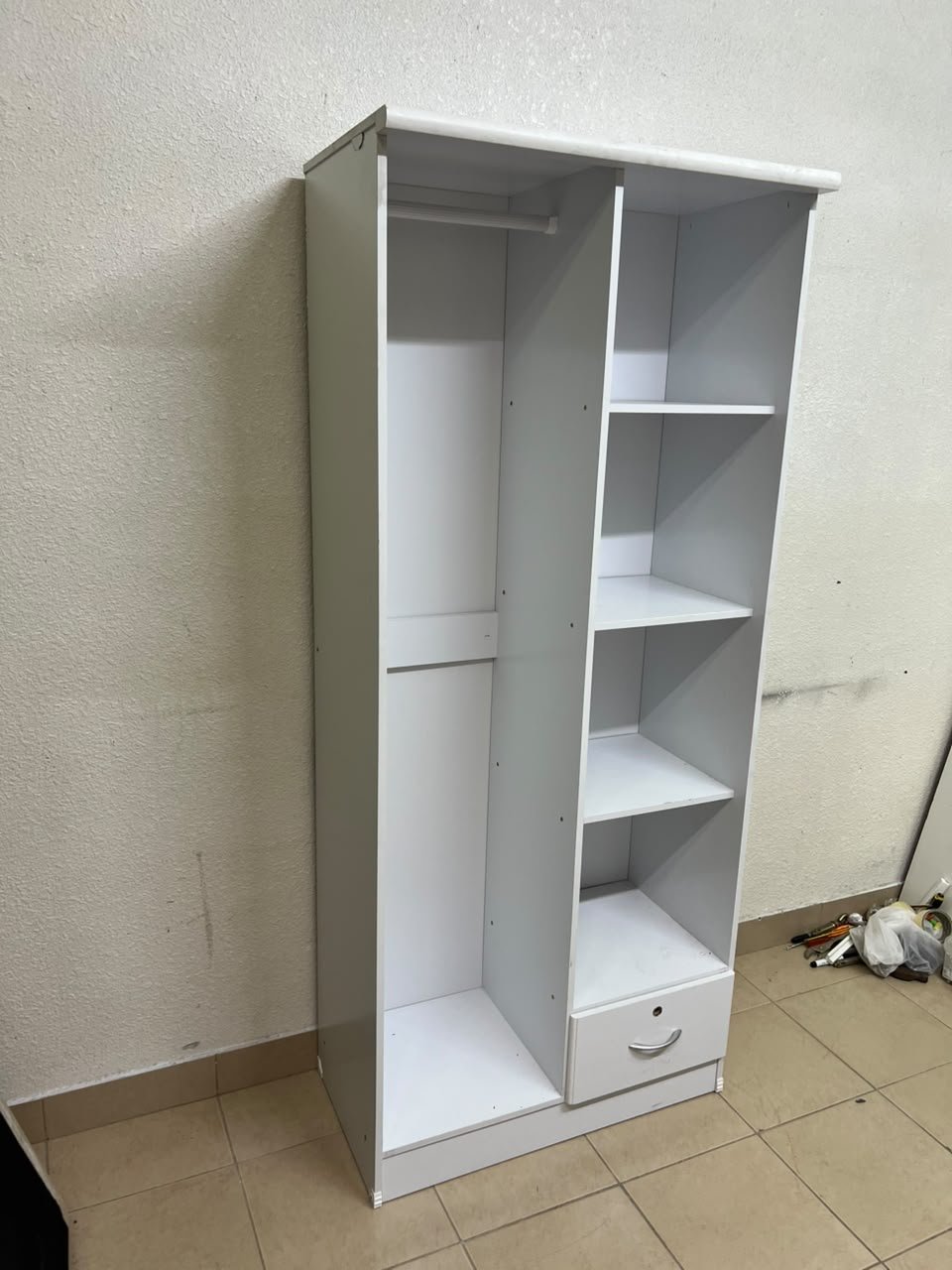 A freestanding, white, geometric wooden wardrobe (closet). - Image 7