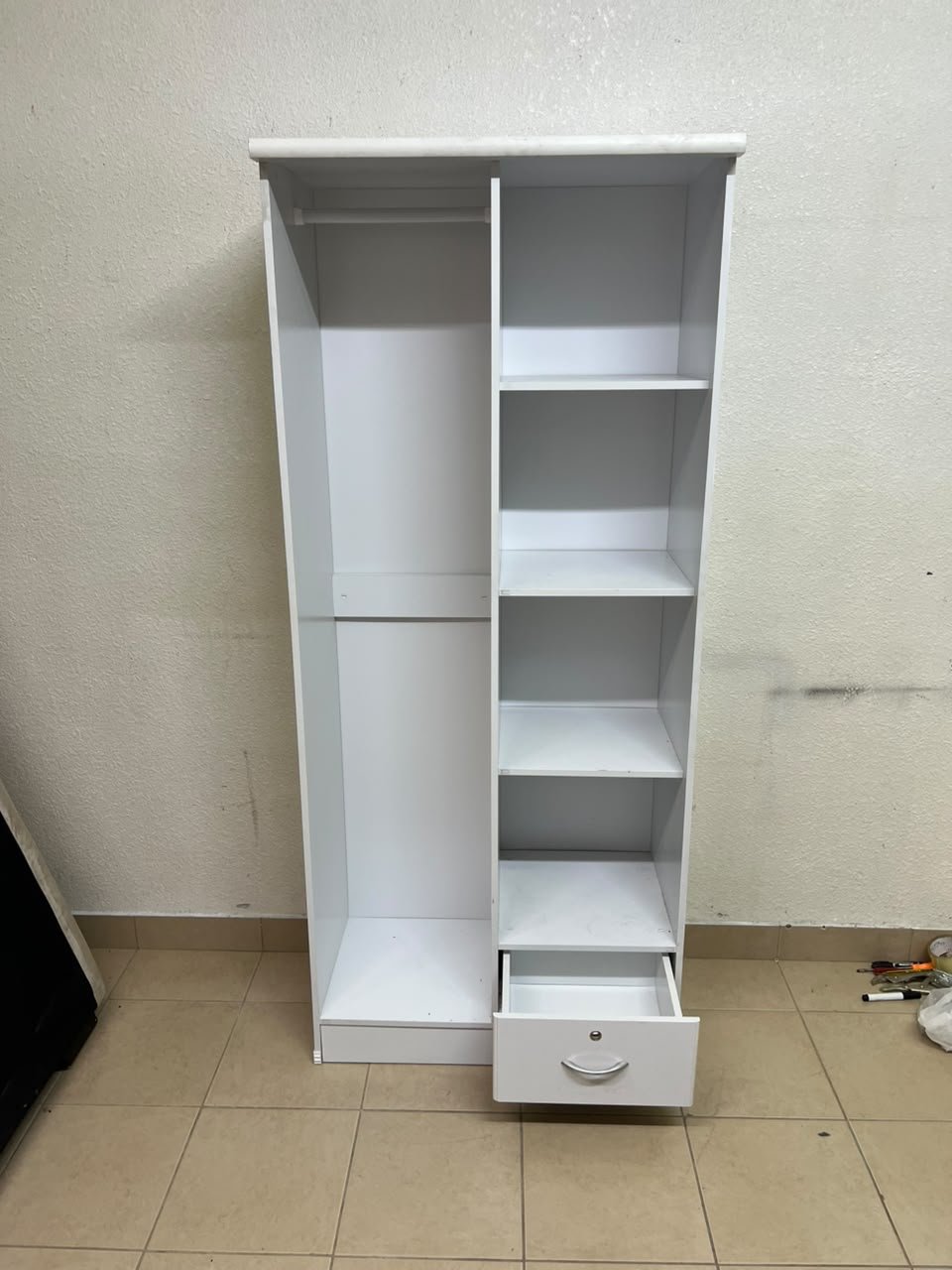 A freestanding, white, geometric wooden wardrobe (closet). - Image 8