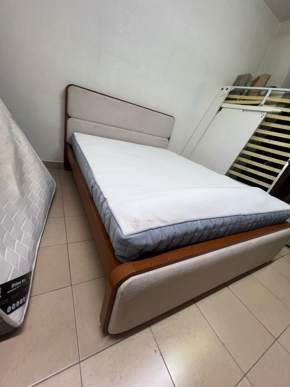 A bed with a mattress, featuring a solid wood frame—such as the "Oboro" or "Nordome" models available at Danube Home—in a super king size (160×200 cm), finished in beige with a brown wooden frame. - Image 5