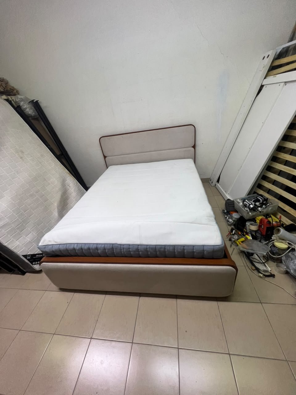 A bed with a mattress, featuring a solid wood frame—such as the "Oboro" or "Nordome" models available at Danube Home—in a super king size (160×200 cm), finished in beige with a brown wooden frame. - Image 7