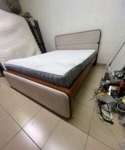 A bed with a mattress, featuring a solid wood frame—such as the "Oboro" or "Nordome" models available at Danube Home—in a super king size (160×200 cm), finished in beige with a brown wooden frame. - Image 9