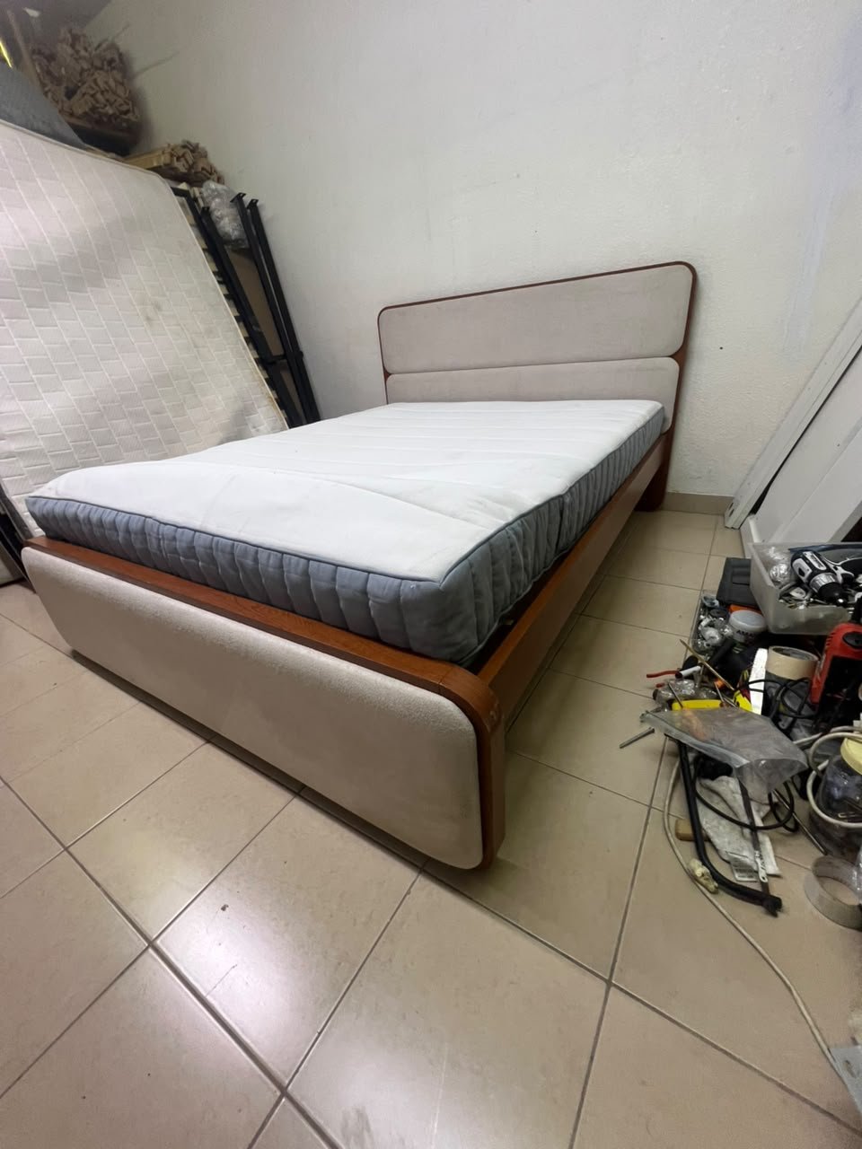 A bed with a mattress, featuring a solid wood frame—such as the "Oboro" or "Nordome" models available at Danube Home—in a super king size (160×200 cm), finished in beige with a brown wooden frame. - Image 9
