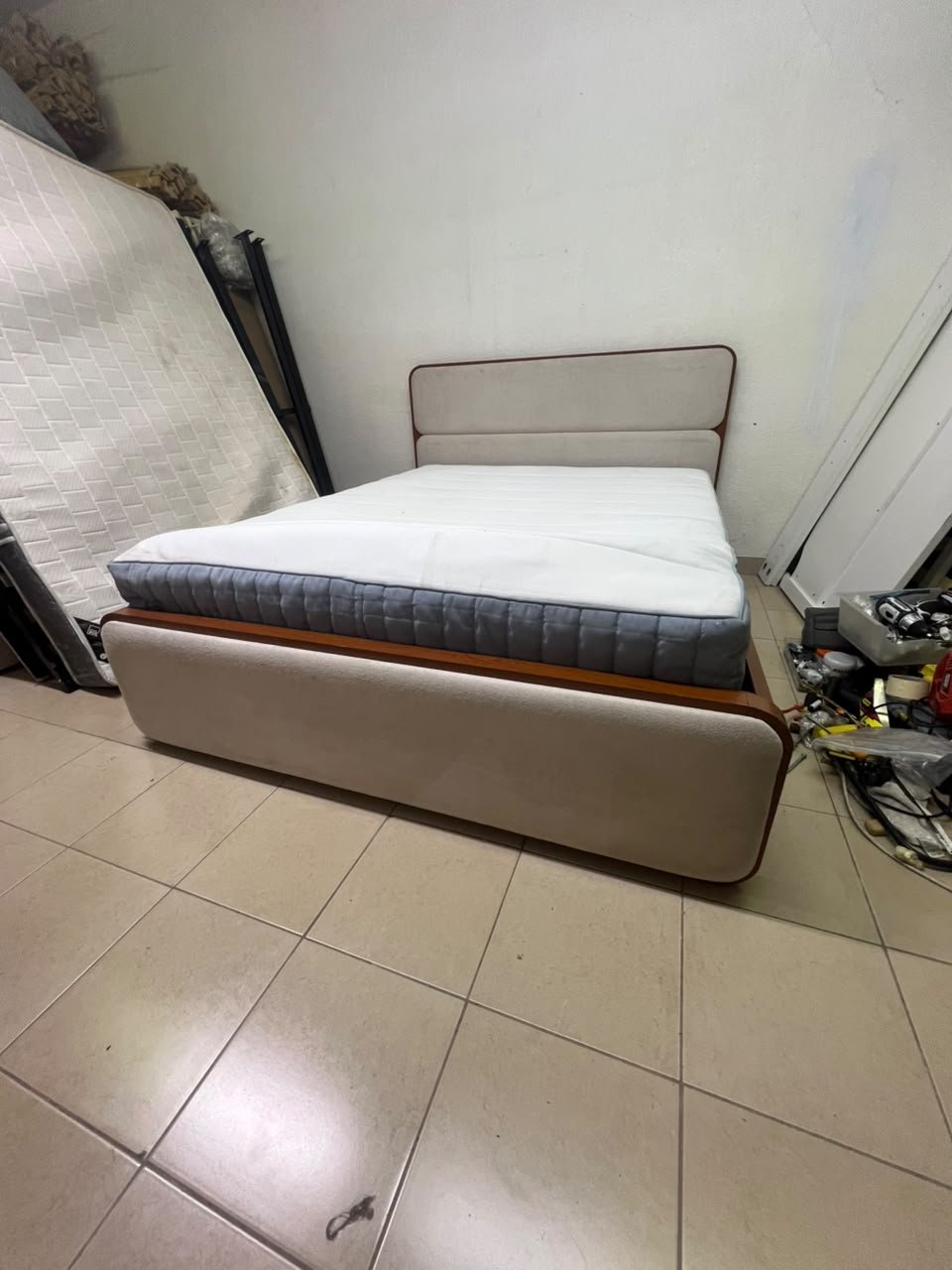 A bed with a mattress, featuring a solid wood frame—such as the "Oboro" or "Nordome" models available at Danube Home—in a super king size (160×200 cm), finished in beige with a brown wooden frame. - Image 11
