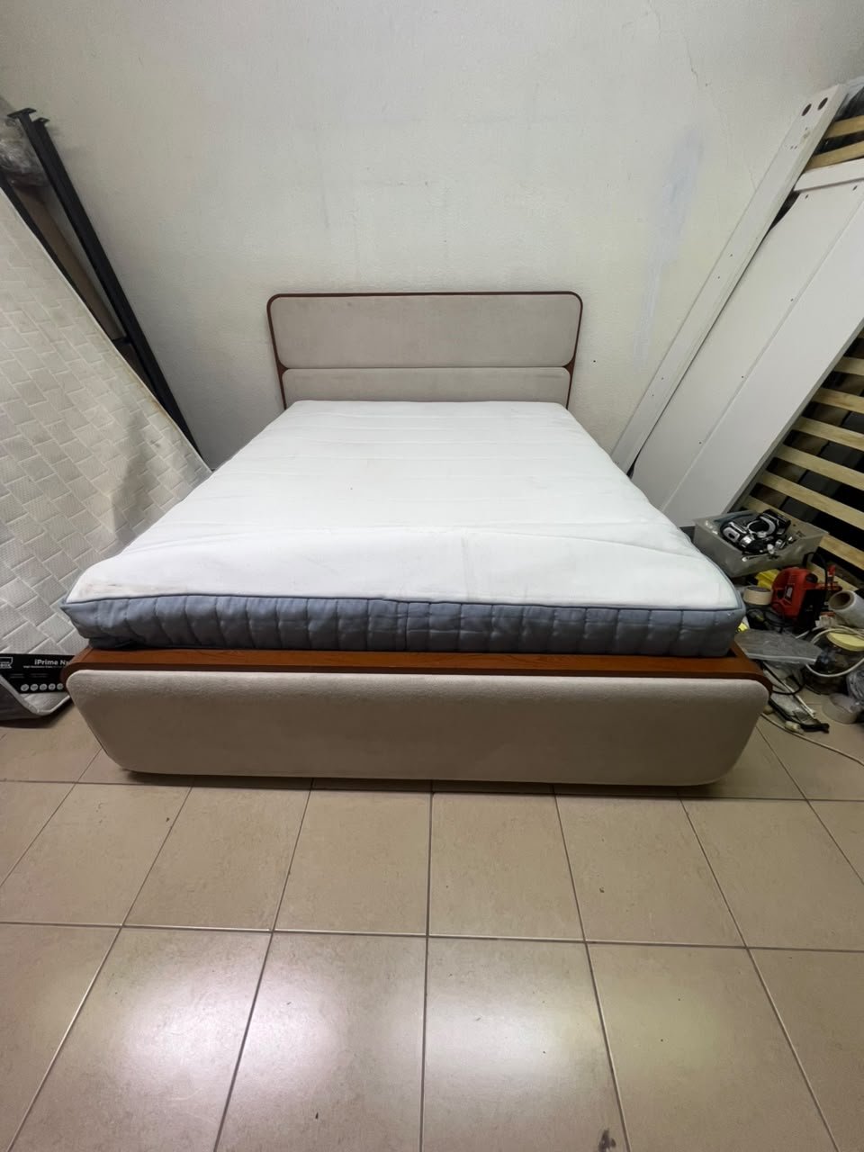 A bed with a mattress, featuring a solid wood frame—such as the "Oboro" or "Nordome" models available at Danube Home—in a super king size (160×200 cm), finished in beige with a brown wooden frame. - Image 2