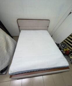A bed with a mattress, featuring a solid wood frame—such as the "Oboro" or "Nordome" models available at Danube Home—in a super king size (160×200 cm), finished in beige with a brown wooden frame. - Image 3