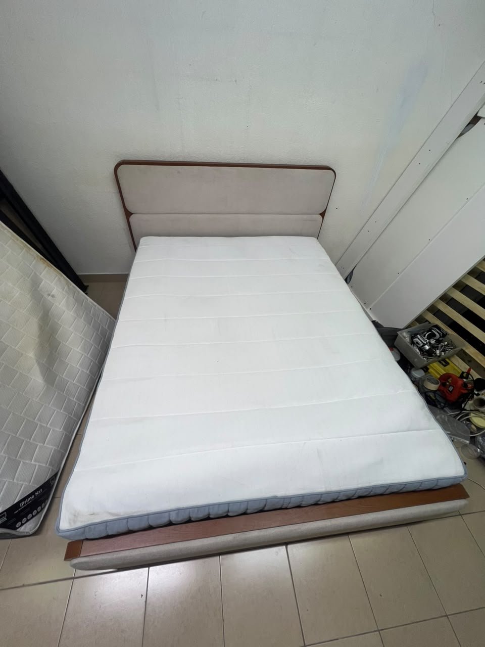 A bed with a mattress, featuring a solid wood frame—such as the "Oboro" or "Nordome" models available at Danube Home—in a super king size (160×200 cm), finished in beige with a brown wooden frame. - Image 3