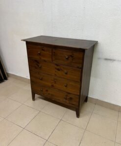 A classic chest of drawers made of solid wood (such as pine or a darker wood), featuring two small drawers at the top and four large, full-width drawers below; it is accented with small, round knobs and elevated wooden legs. - Image 2