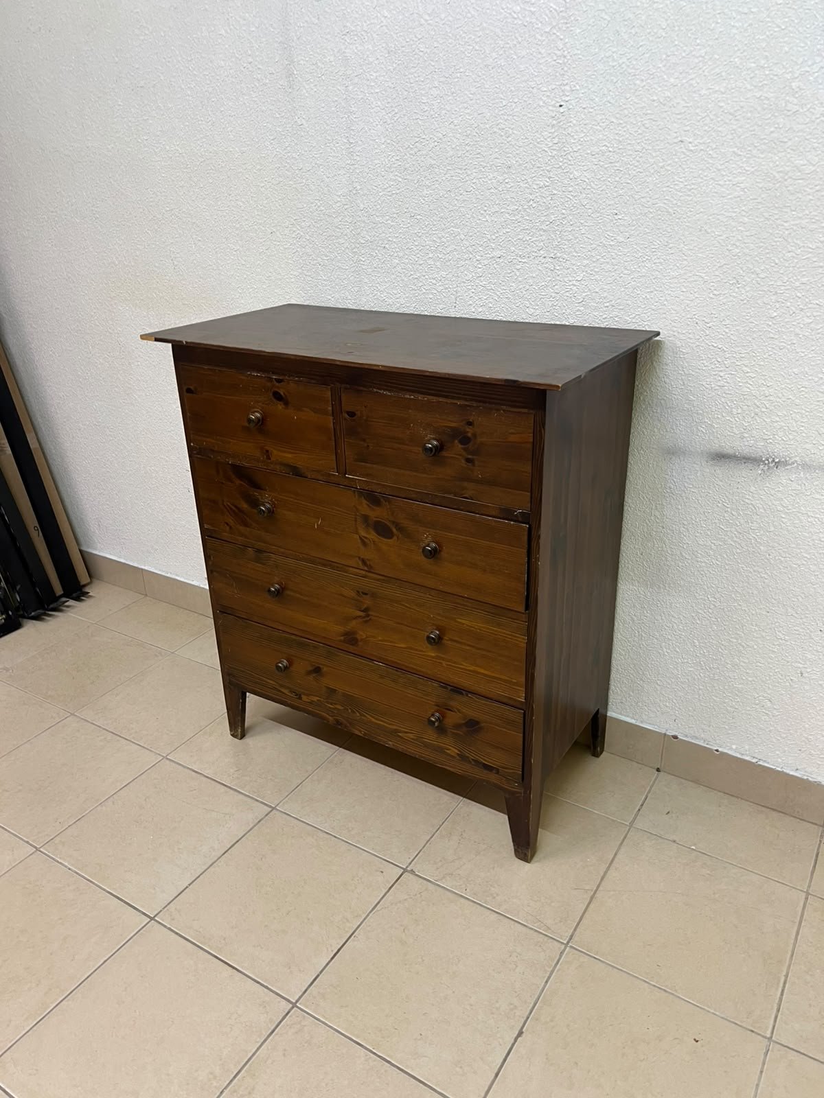 A classic chest of drawers made of solid wood (such as pine or a darker wood), featuring two small drawers at the top and four large, full-width drawers below; it is accented with small, round knobs and elevated wooden legs. - Image 9