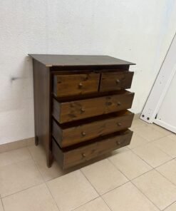 A classic chest of drawers made of solid wood (such as pine or a darker wood), featuring two small drawers at the top and four large, full-width drawers below; it is accented with small, round knobs and elevated wooden legs. - Image 11