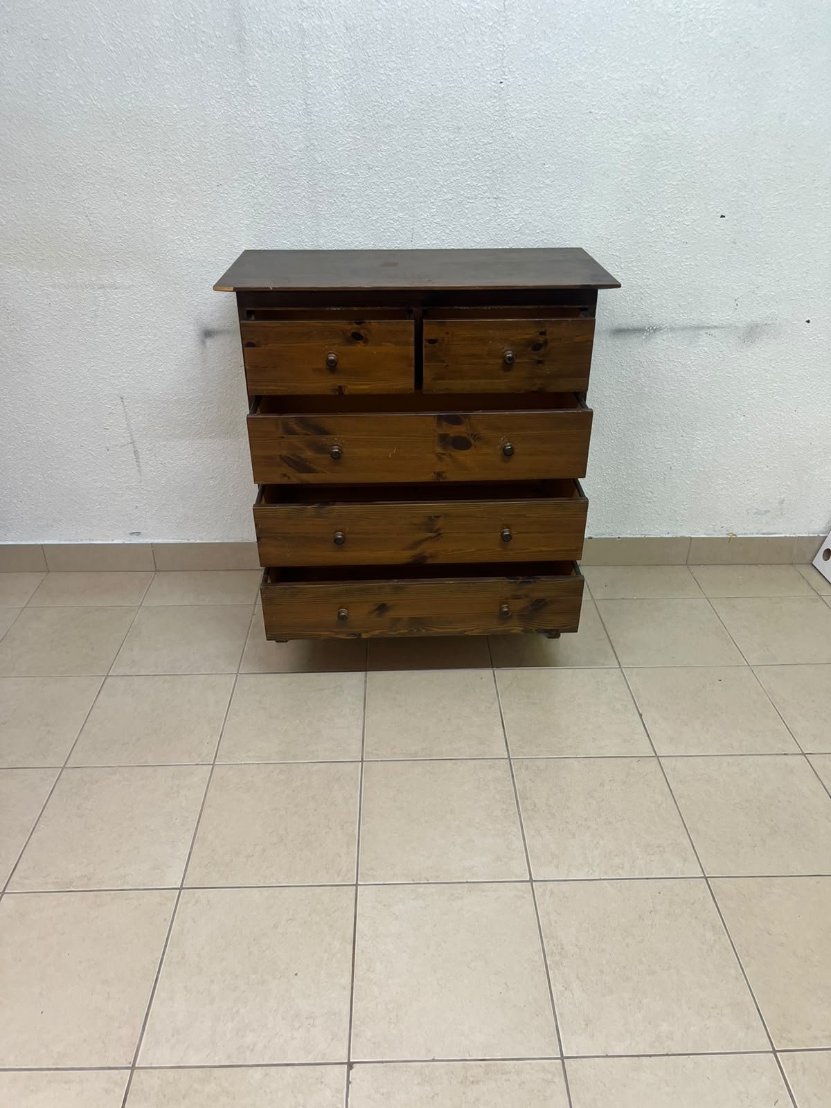A classic chest of drawers made of solid wood (such as pine or a darker wood), featuring two small drawers at the top and four large, full-width drawers below; it is accented with small, round knobs and elevated wooden legs. - Image 6