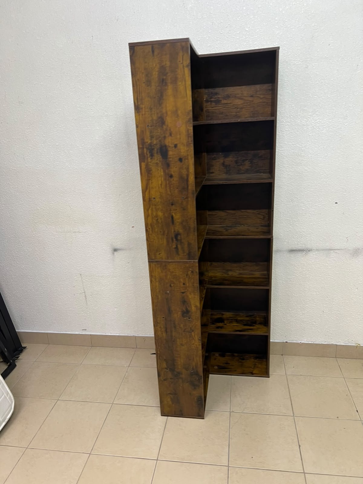 An L-shaped corner bookshelf, crafted from engineered wood in a dark, rustic brown (Vintage/Amber Pine) finish. - Image 6