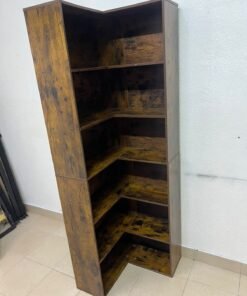 An L-shaped corner bookshelf, crafted from engineered wood in a dark, rustic brown (Vintage/Amber Pine) finish.