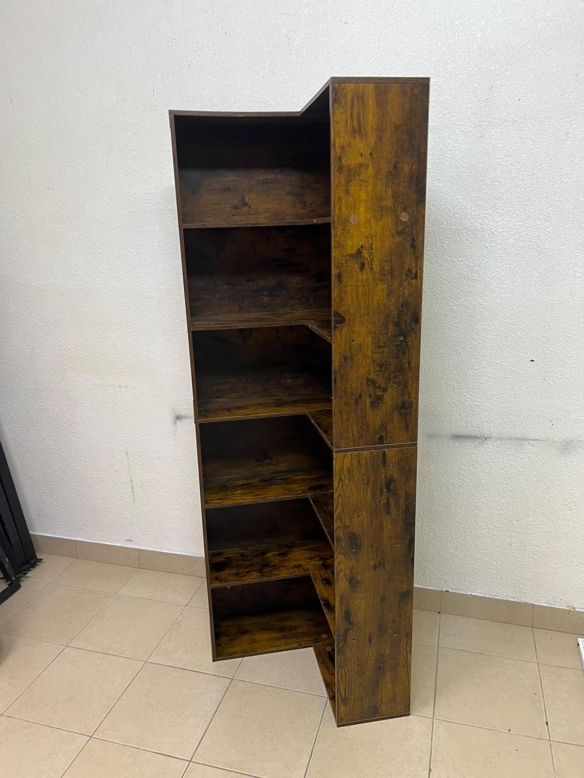 An L-shaped corner bookshelf, crafted from engineered wood in a dark, rustic brown (Vintage/Amber Pine) finish. - Image 3