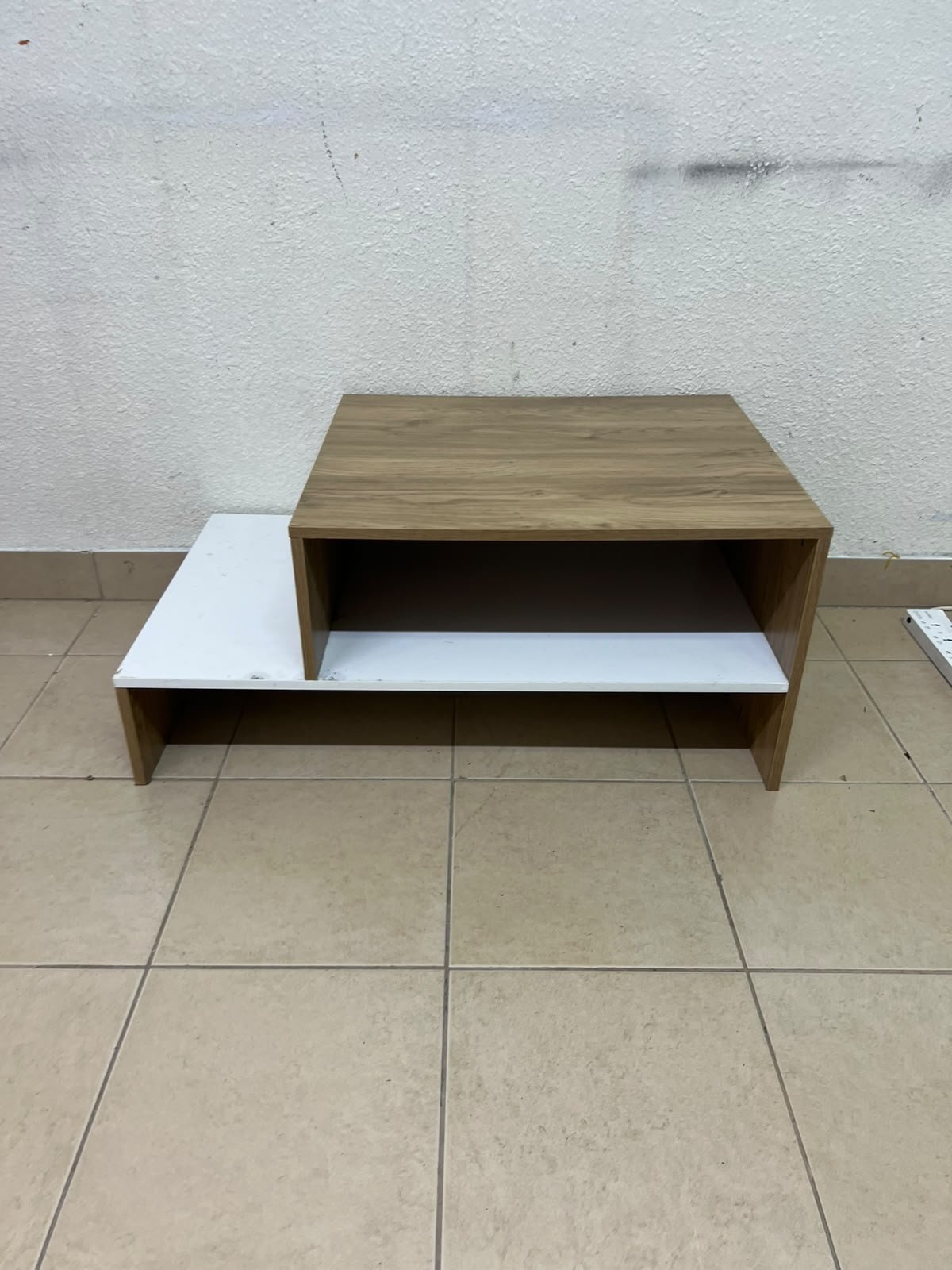 A coffee table with a modern, tiered design (such as the Bruno coffee table by Alford, available at Home Box UAE or Danube Home). - Image 2