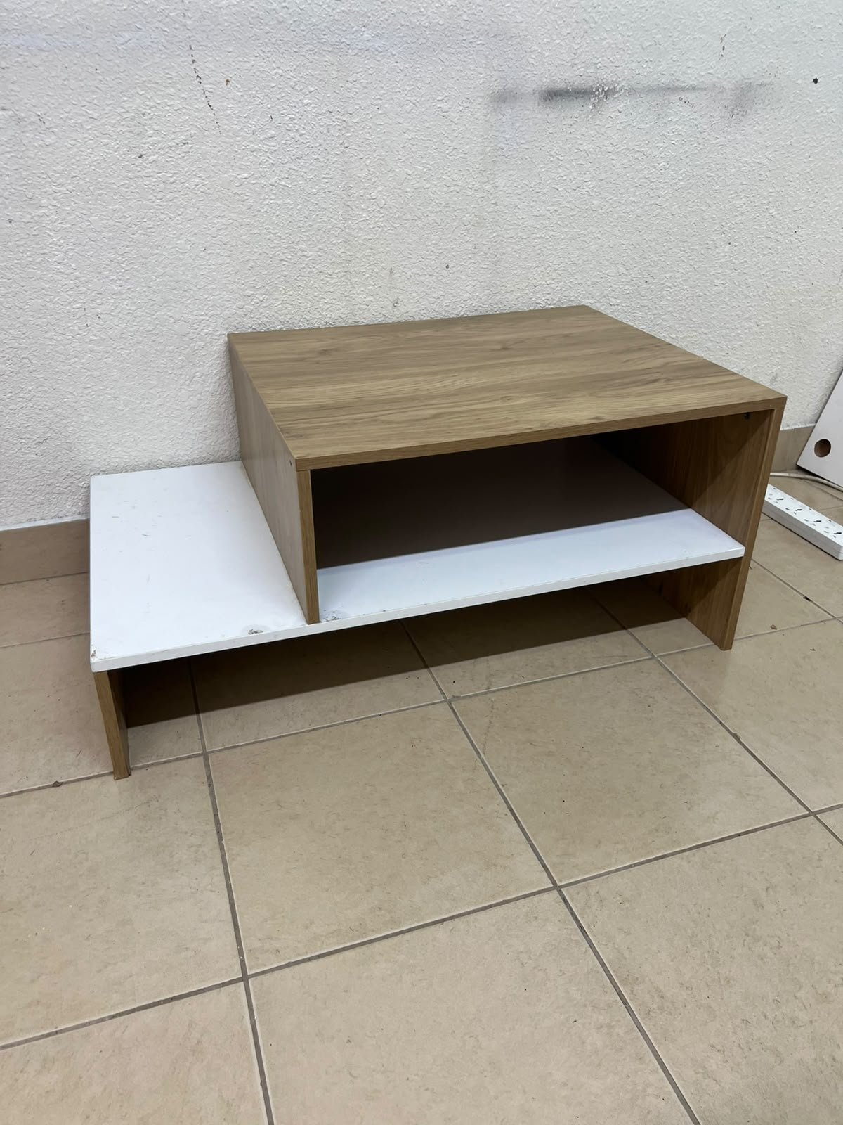 A coffee table with a modern, tiered design (such as the Bruno coffee table by Alford, available at Home Box UAE or Danube Home). - Image 7