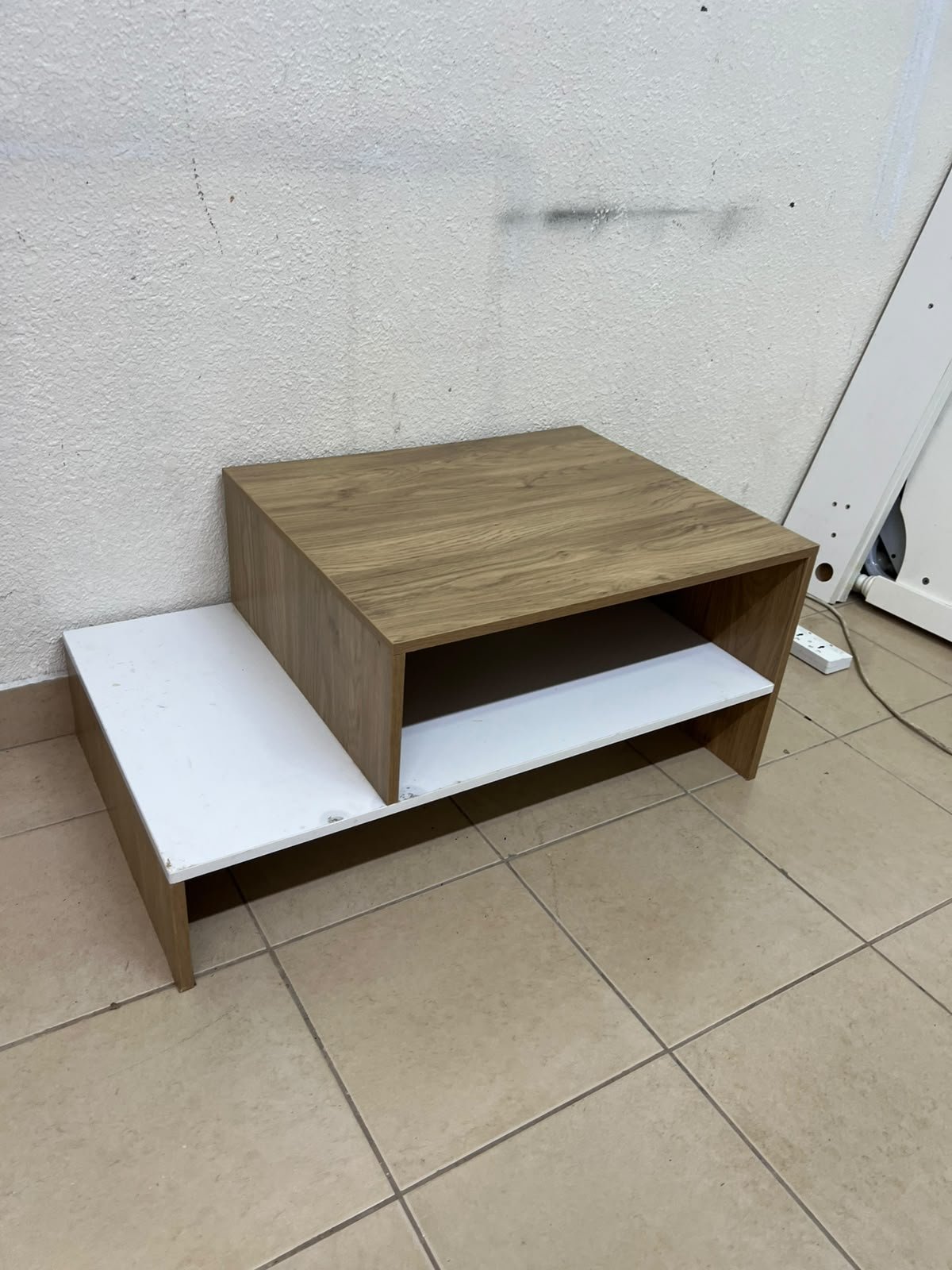 A coffee table with a modern, tiered design (such as the Bruno coffee table by Alford, available at Home Box UAE or Danube Home). - Image 6