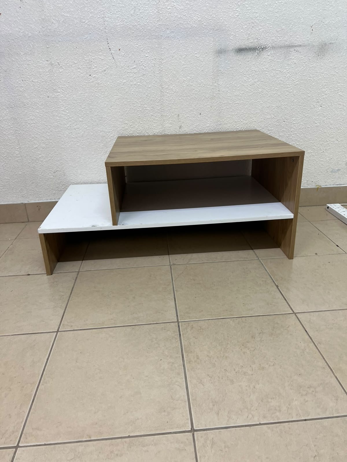 A coffee table with a modern, tiered design (such as the Bruno coffee table by Alford, available at Home Box UAE or Danube Home). - Image 5