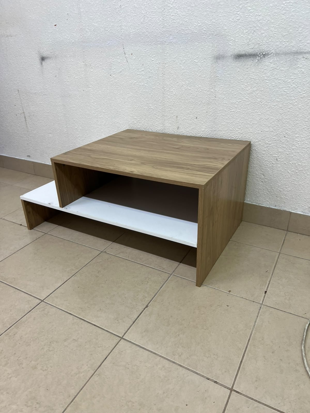 A coffee table with a modern, tiered design (such as the Bruno coffee table by Alford, available at Home Box UAE or Danube Home). - Image 3